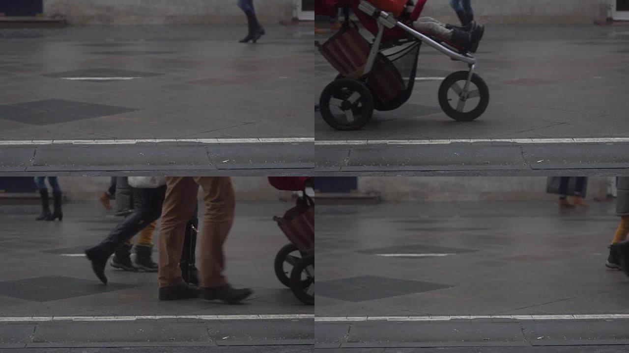 街上带婴儿车的无法识别的人的慢动作视频