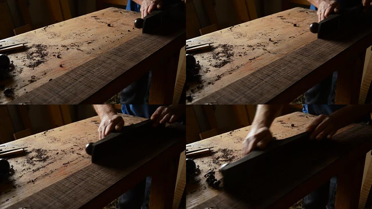 琴师用刨木机打磨木材，在工作场所制造新吉他