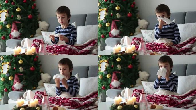小孩，男孩，在圣诞节期间，他的鼻子和打喷嚏，躺在床上生病