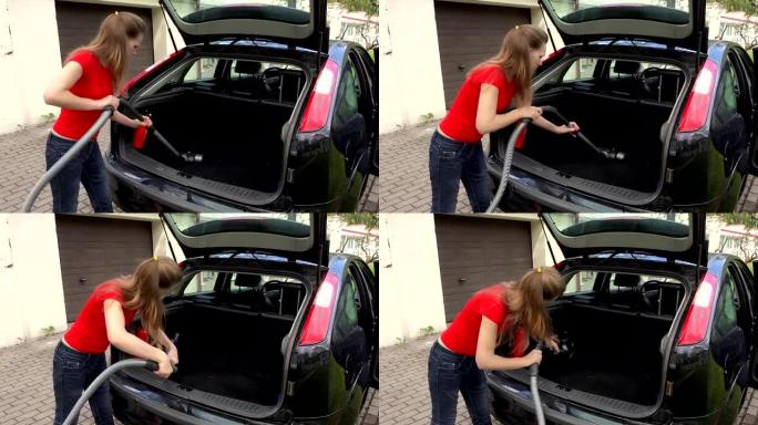 使用真空吸尘器清洁汽车内饰的女人。
