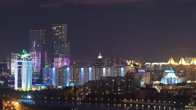 市中心和中央商务区的高架夜景，塔楼从屋顶、哈萨克斯坦、阿斯塔纳延时