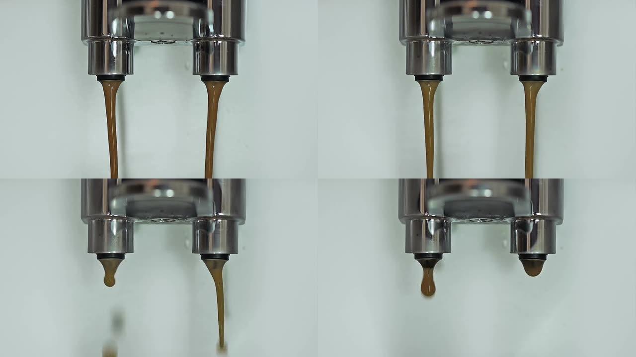 咖啡浓缩咖啡从喷嘴出来。
