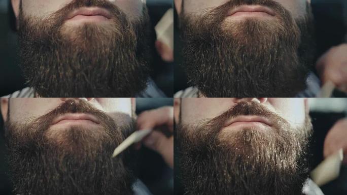 男性胡须护理。男性发型。理发师胡子。男性手梳胡须