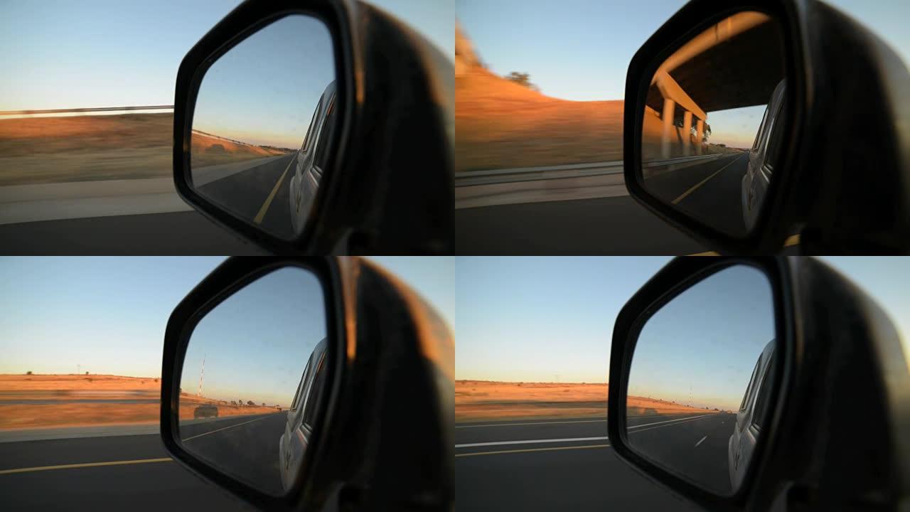开车通过美丽和稀疏的南部非洲风景在日落，从车内拍摄，看着反射在侧视镜