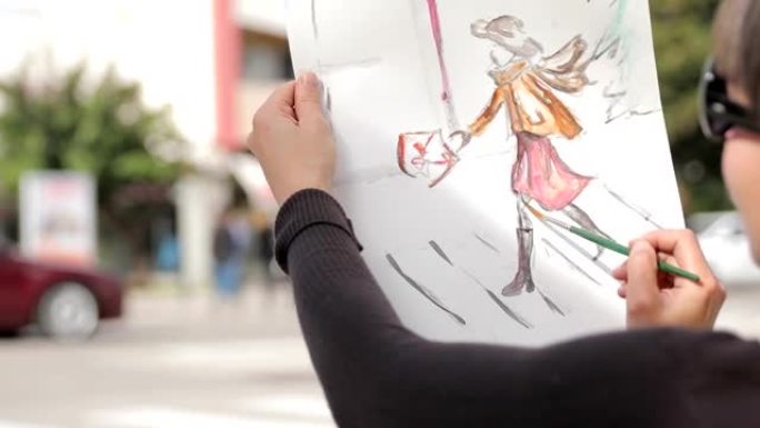 艺术家在城市街道上画素描