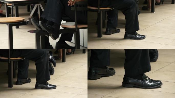 商人的腿坐在椅子上，各种镜头和位置