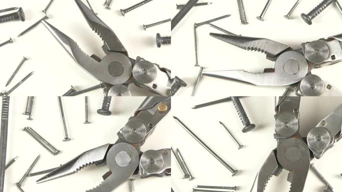 白色指甲中的金属圆嘴钳的一部分，旋转