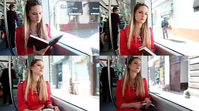 美女坐电车时看书