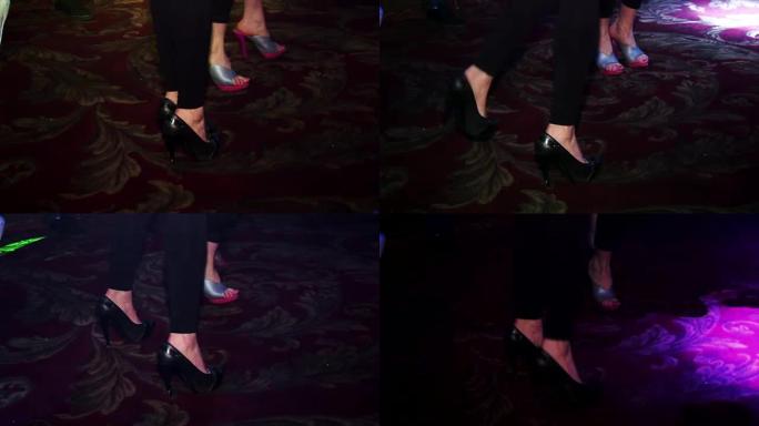 脚的特写镜头，在俱乐部的地毯上跳舞