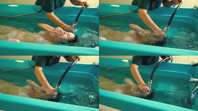 一个穿着泳衣的女孩在按摩过程中潜入水下，慢动作