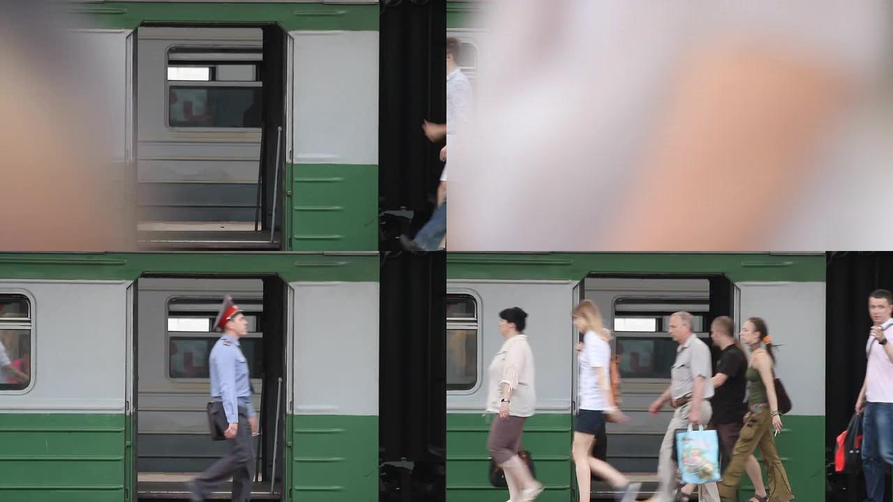 乘客在月台上，在火车敞开的车门的背景上