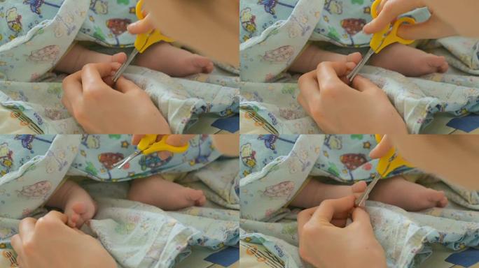 母亲剪婴儿的指甲