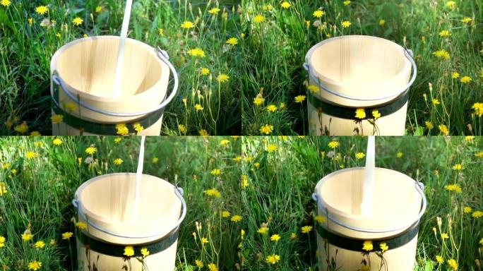 将牛奶倒入木桶中的两个视频-真正的慢动作