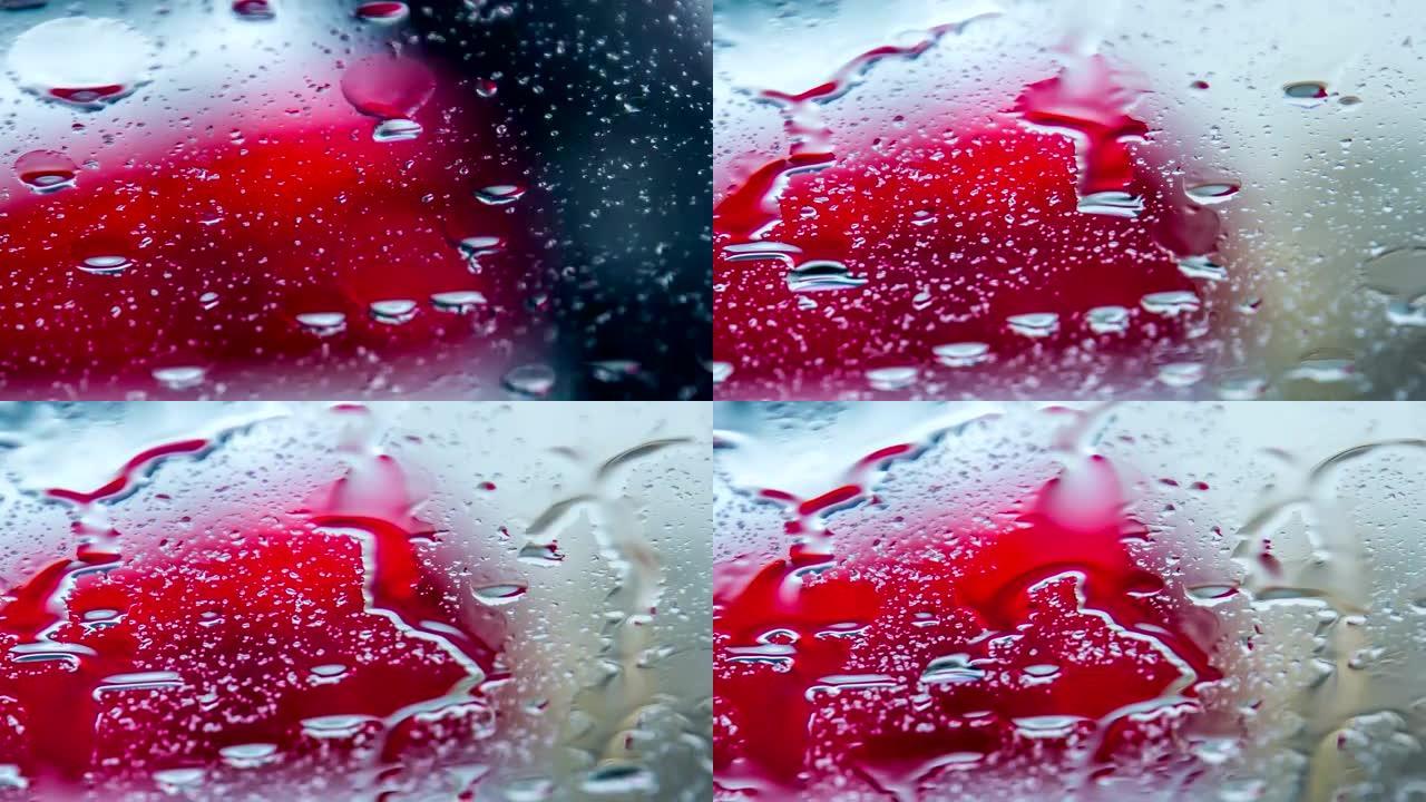 雨滴在雨中在车窗上奔跑