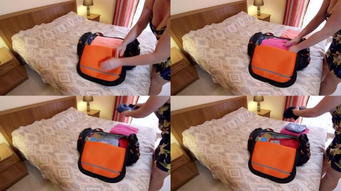 女旅行者在酒店房间的床上打开旅行包