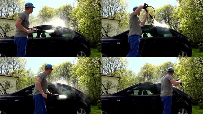 男人，用高压喷水冲洗自己的汽车