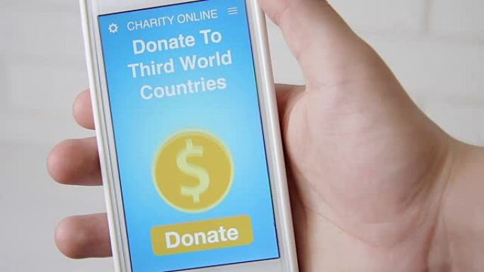 男子使用智能手机上的慈善应用程序向第三世界国家进行在线捐赠