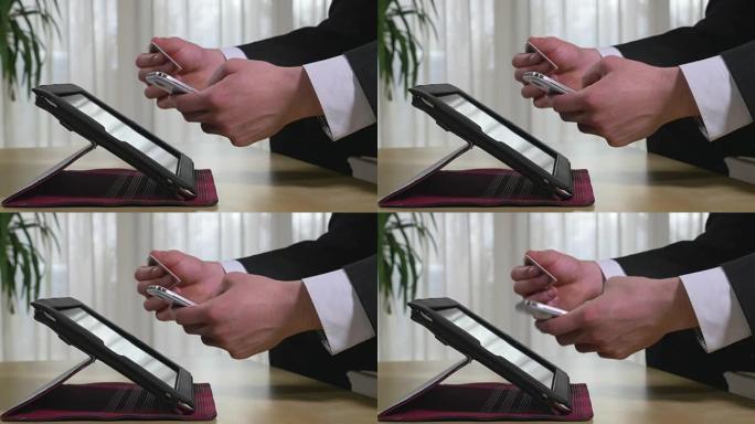 年轻的商人在智能手机上购物或使用在线银行