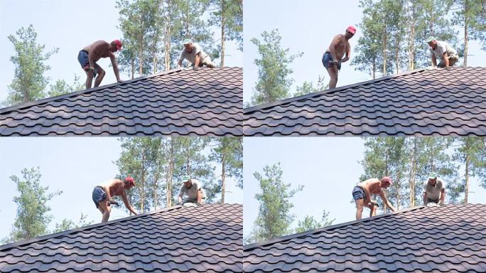 Roofer将金属屋面材料固定在屋顶的角落。