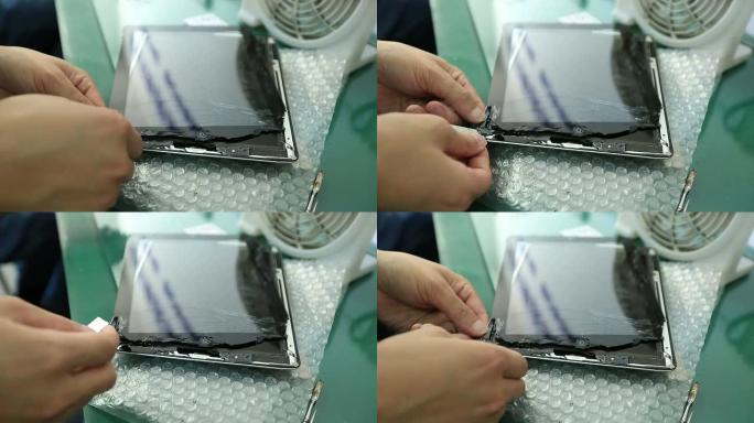 人手修复受损平板电脑