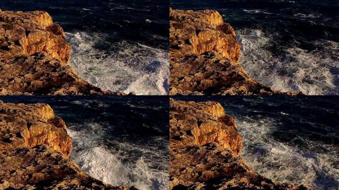 彩色悬崖线，深蓝色的海洋和破碎的波浪