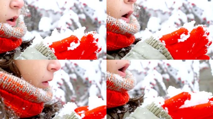 穿着红领巾和手套吹雪的女孩特写