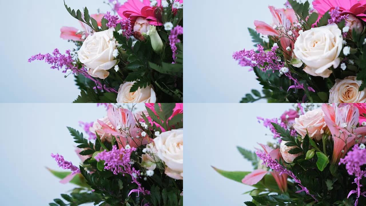 特写。花束，在白色背景上旋转，花卉组成由非洲菊，Eustoma，玫瑰yana奶油，Alstroeme