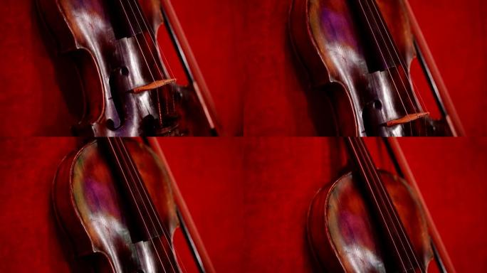 美丽的红色背景上的小提琴。