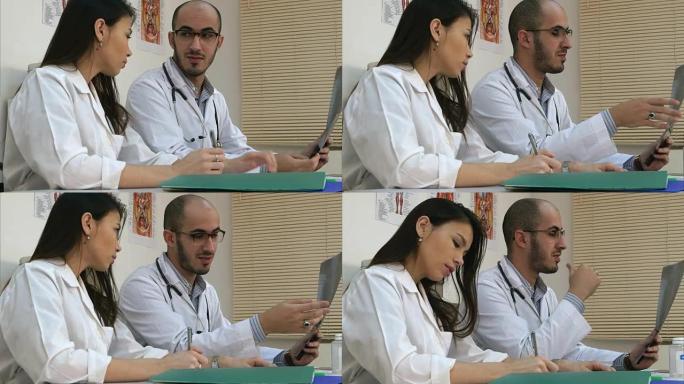 男医生教他的女学员如何分析x射线图像