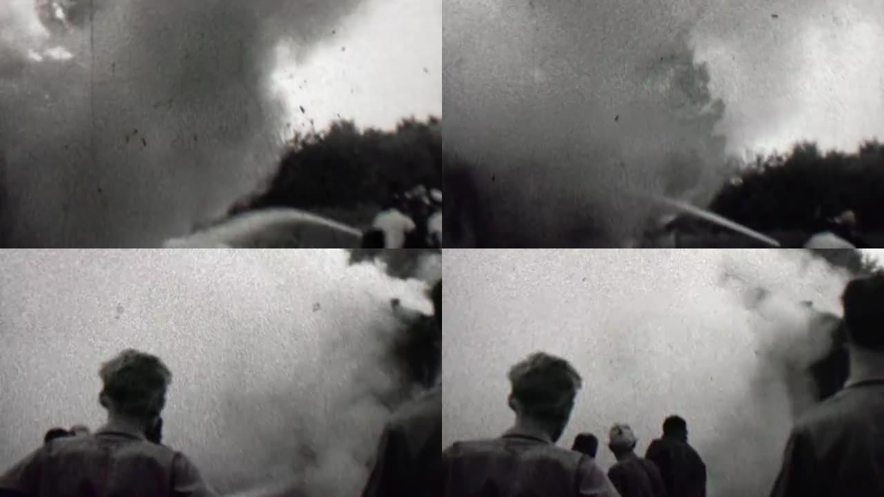 1939: 燃烧建筑消防员水管喷烟人群手表。