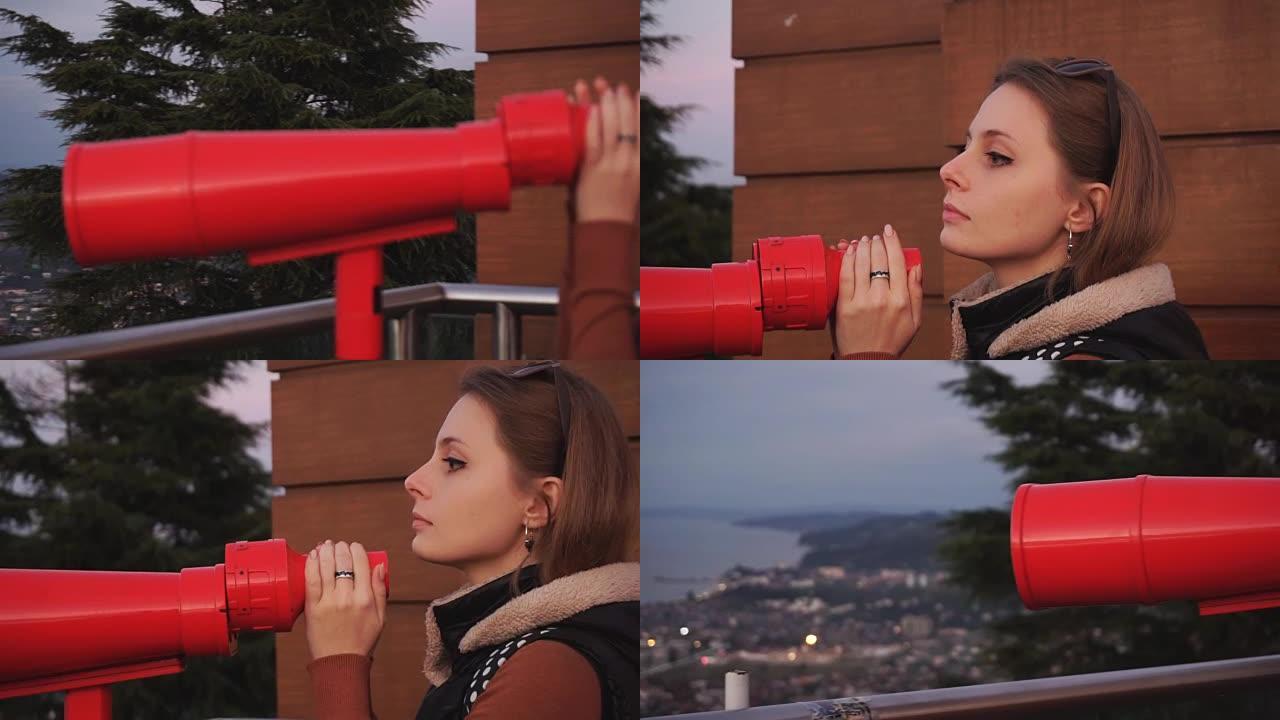 旅行: 年轻的女性游客在日落时通过投币式双筒望远镜看着城市。特写镜头，手持，慢动作60fps