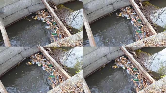 塑料瓶和其他垃圾污染了水环境。