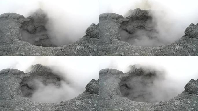 活火山火山口中堪察加沸腾的热泥锅上的火山活动