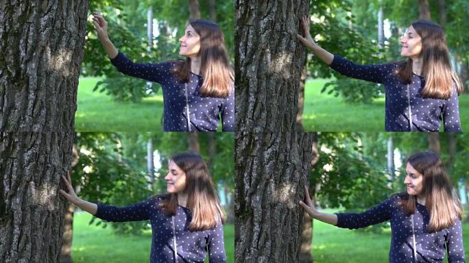 女人微笑着触摸树