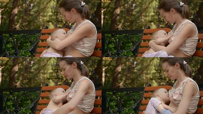 年轻女子母乳喂养她的小婴儿