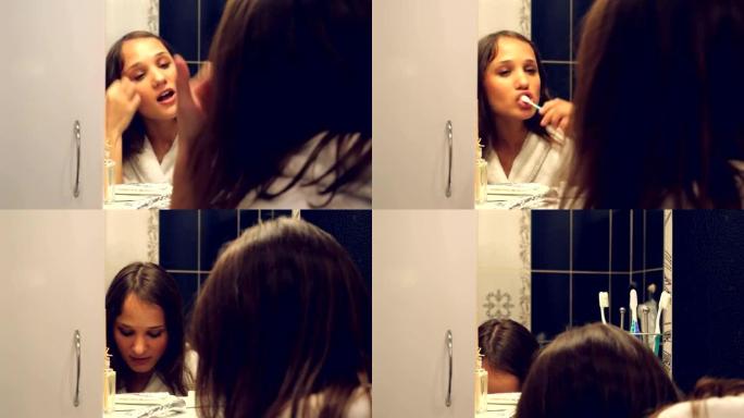 年轻美女在镜子前刷牙