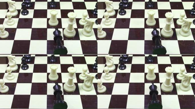 国际象棋的残局位置，黑王被击败，并在国际象棋板上的白皇后附近摇摆