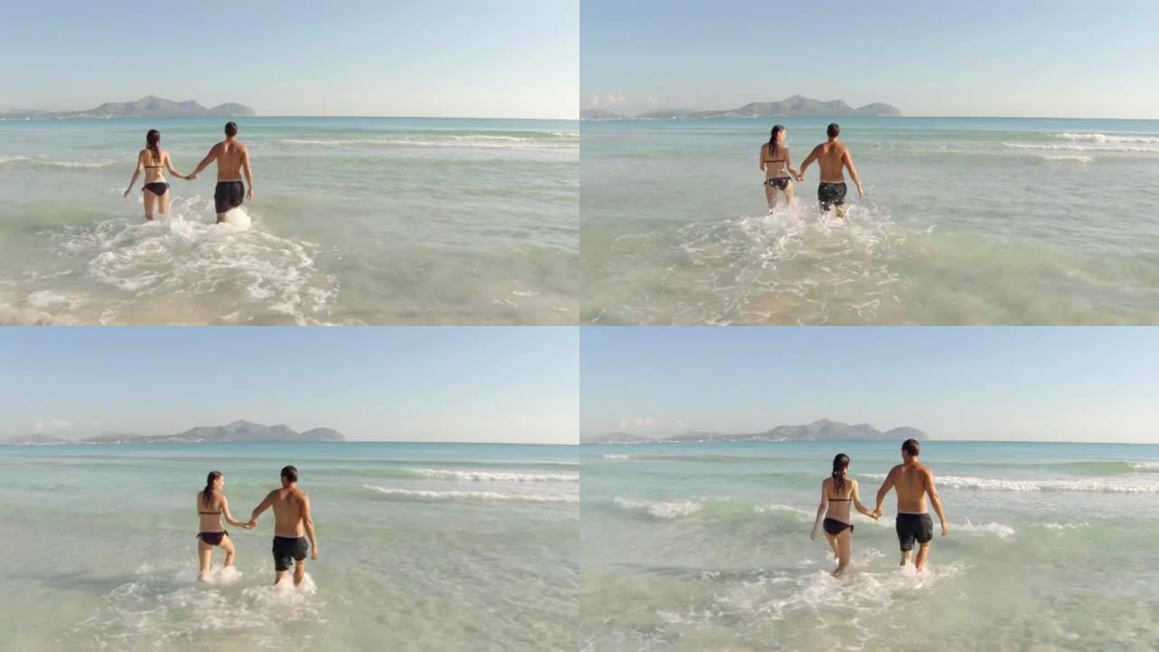 年轻夫妇跑进水里