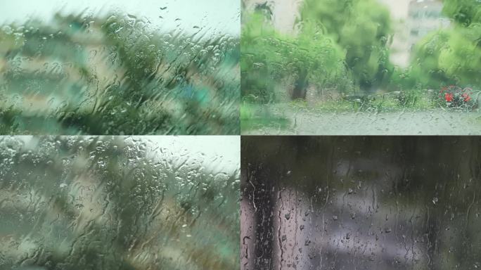 汽车玻璃窗上的雨水露珠下雨天