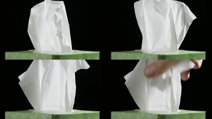 男性人手纸巾盒慢动作黑色背景