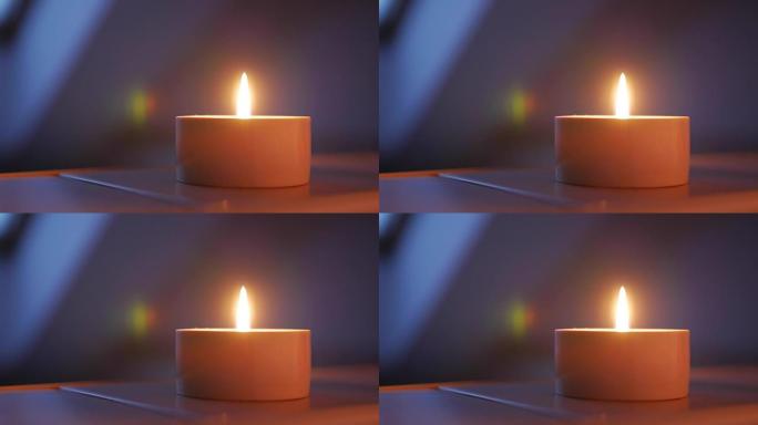 蜡烛的特写镜头，浅景深，重点放在灯芯和火焰上