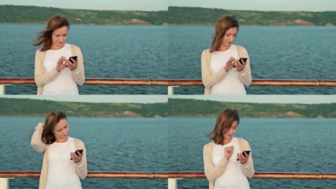 在游轮甲板上使用手机的女人