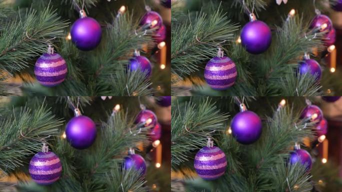 圣诞树上有紫色球的移动镜头