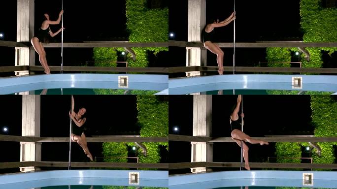 钢管舞演员晚上在游泳池旁表演钢管舞