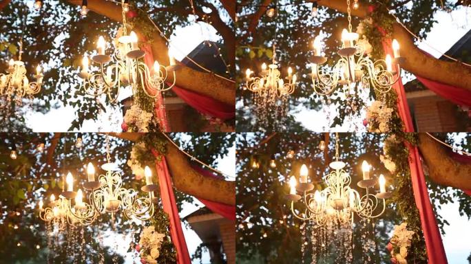 带有鲜花和花环的水晶吊灯在婚礼和派对上闪耀。假日装饰，乡村风格