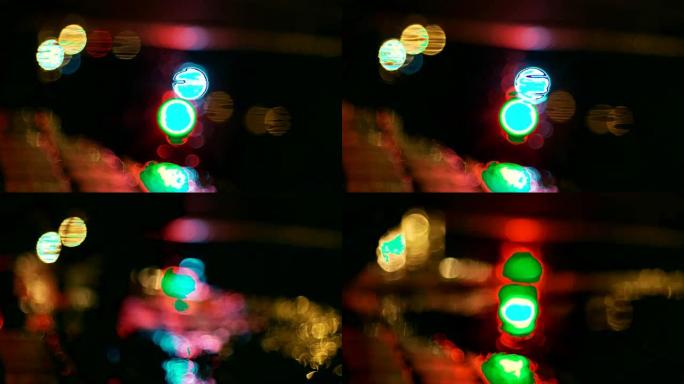 游泳池中的交通信号灯反射，过往的汽车，夜晚
