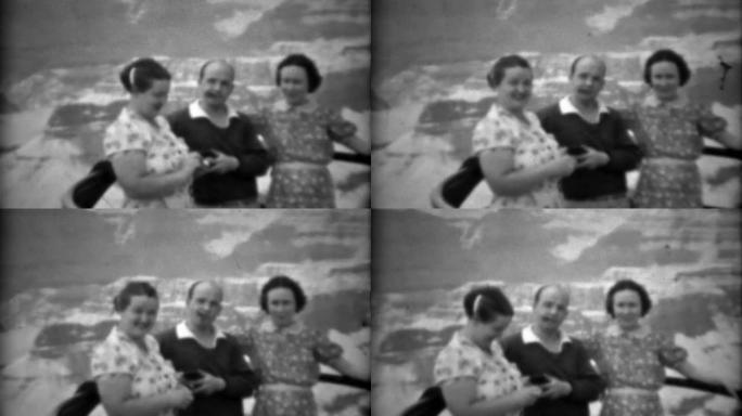 1937: 抽雪茄的男人和2个女人在大峡谷护栏摆姿势。