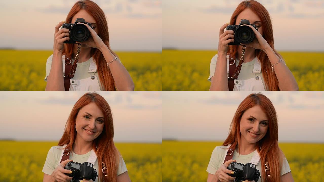 一位年轻的女摄影师在盛开的田野里拍照并微笑