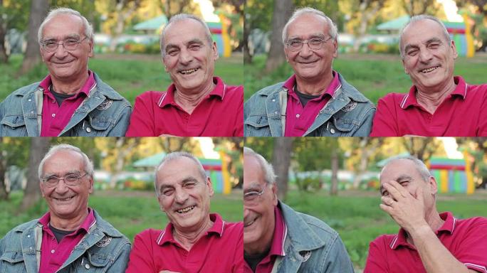 微笑老人在公园的长凳上看着相机的肖像