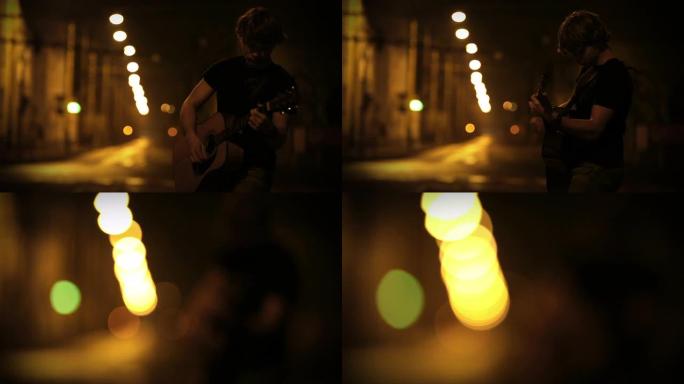 一个年轻的男吉他手在夜晚空荡荡的街道上表演